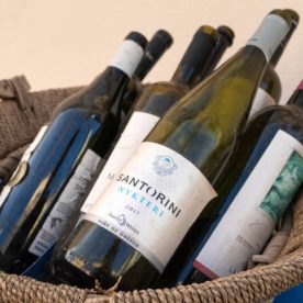 31st Oct 2019 - Santorini, Greece. Empty glass bottles of Santorini Nykteri vine in the basket.