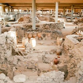 Santorini, Greece - June 26, 2015: Akrotiri is an archaeological site from the Minoan Bronze Age on the Greek island of Santorini (Thera). Photo of recovered aincient buildings and decorated pottery.